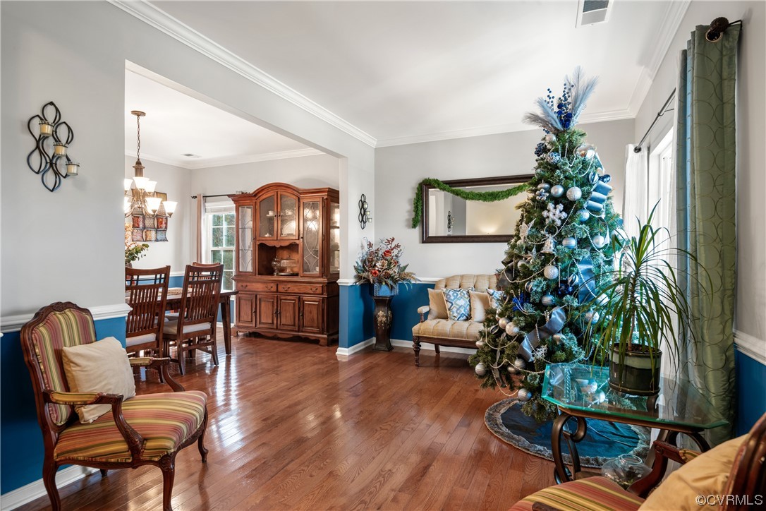 7031 Crackerberry Drive Moseley, VA 23120 - Photo 12 of 47 a living room with furniture a potted plant and a fireplace