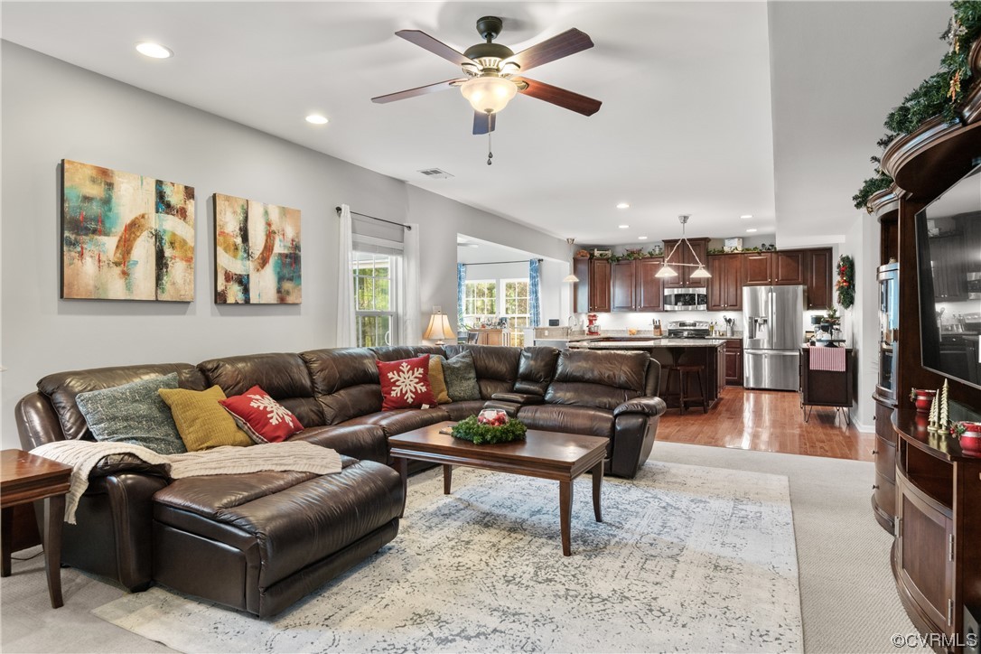 7031 Crackerberry Drive Moseley, VA 23120 - Photo 15 of 47 a living room with furniture and kitchen view