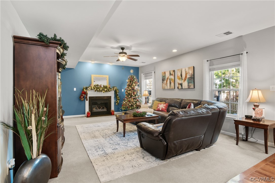 7031 Crackerberry Drive Moseley, VA 23120 - Photo 16 of 47 a living room with furniture and a fireplace