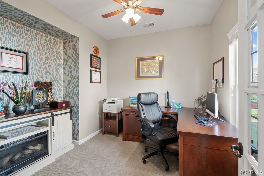 7031 Crackerberry Drive Moseley, VA 23120 - Photo 17 of 47 a view of a workspace with furniture and a window