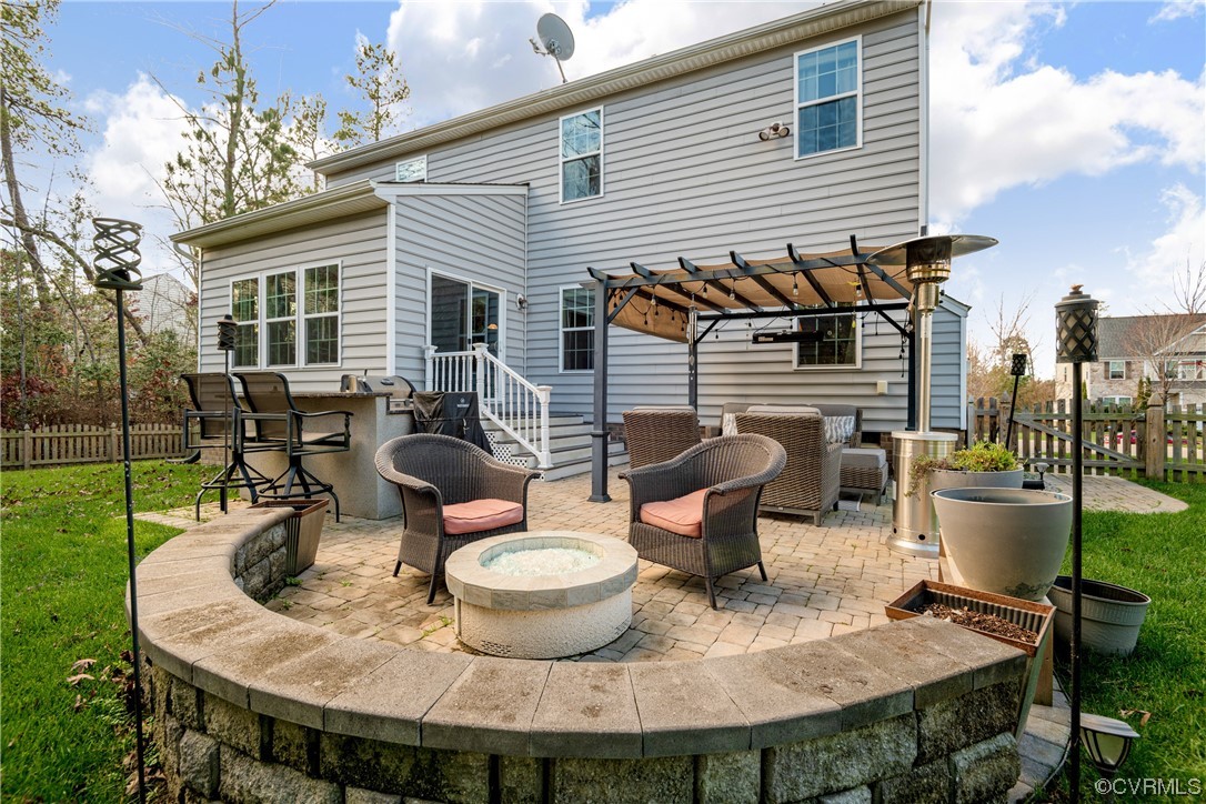 7031 Crackerberry Drive Moseley, VA 23120 - Photo 2 of 47 a view of a house with backyard sitting area and garden
