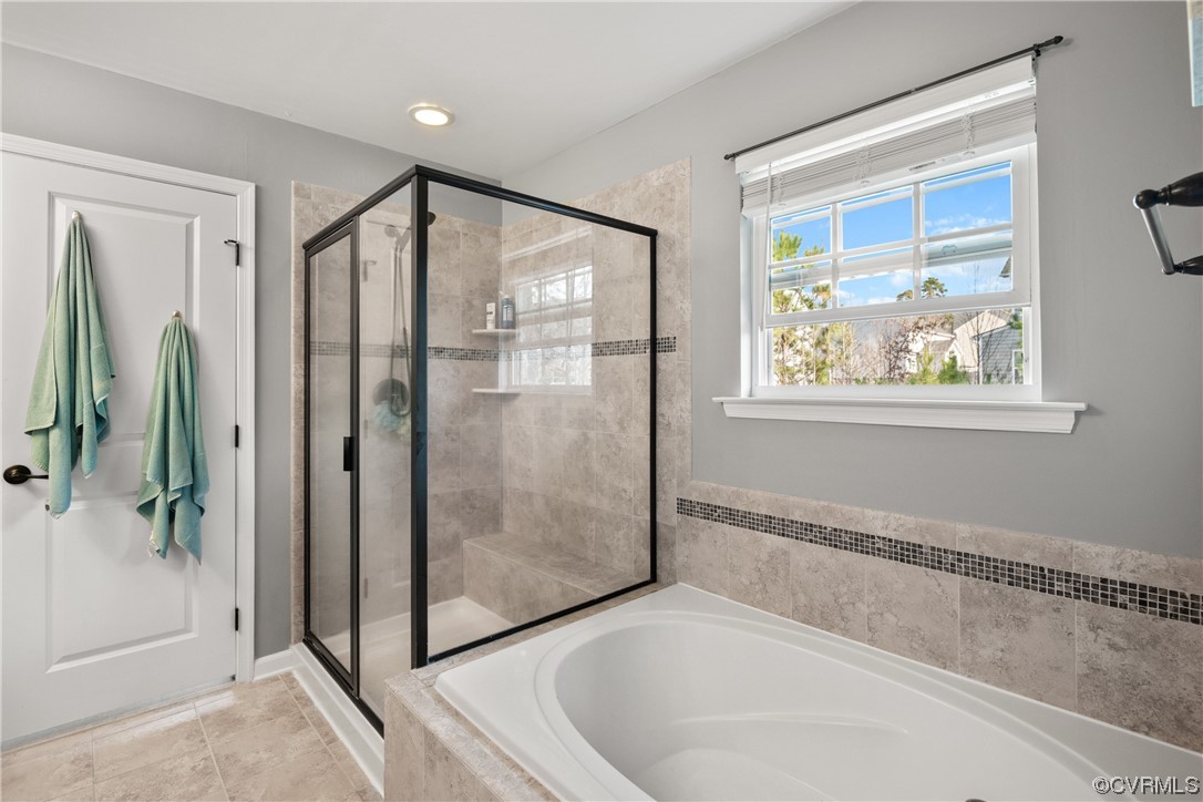 7031 Crackerberry Drive Moseley, VA 23120 - Photo 22 of 47 a spacious bathroom with a bathtub and shower