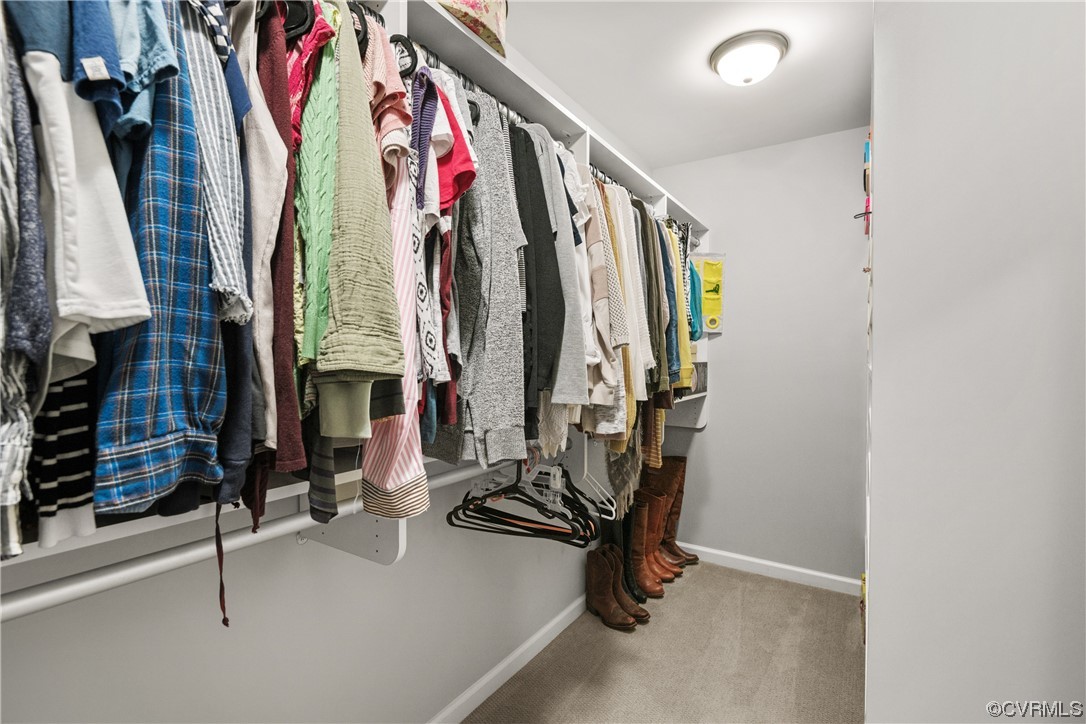 7031 Crackerberry Drive Moseley, VA 23120 - Photo 23 of 47 a view of walk in closet with clothes