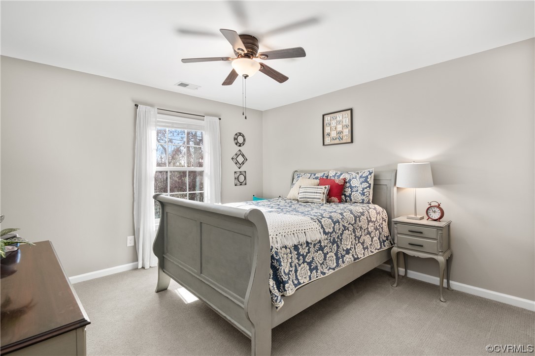 7031 Crackerberry Drive Moseley, VA 23120 - Photo 27 of 47 a bedroom with a bed and a window