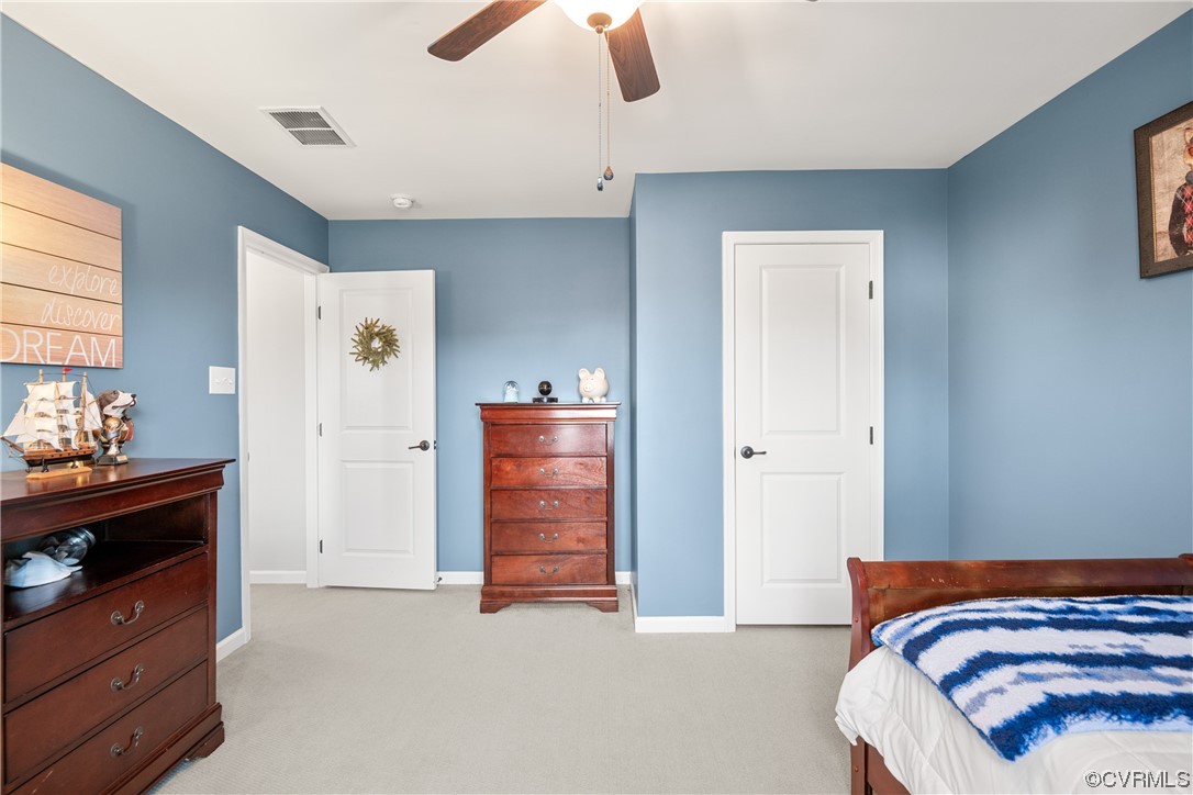 7031 Crackerberry Drive Moseley, VA 23120 - Photo 30 of 47 a bedroom with a bed and a dresser