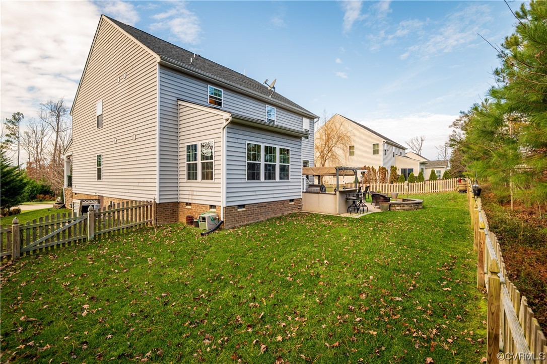 7031 Crackerberry Drive Moseley, VA 23120 - Photo 36 of 47 a view of a house with backyard and a tree