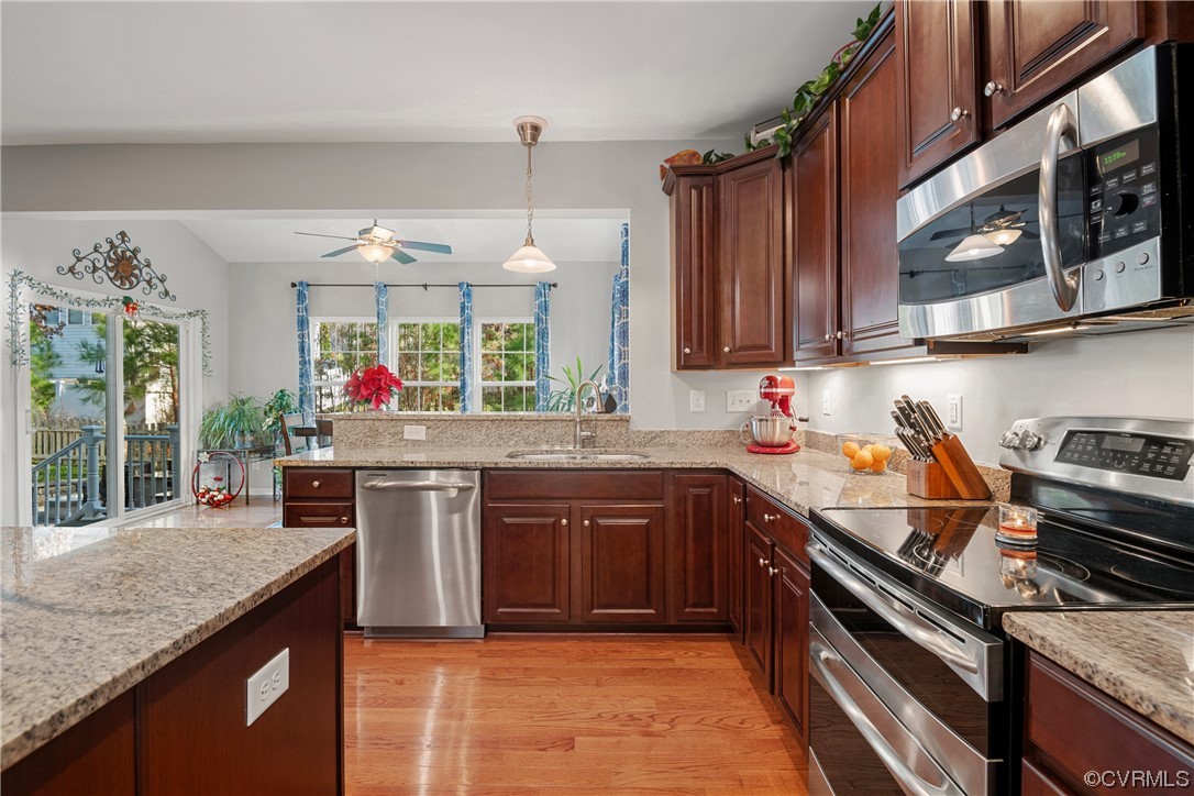 7031 Crackerberry Drive Moseley, VA 23120 - Photo 6 of 47 a kitchen with a stove top oven sink and cabinets