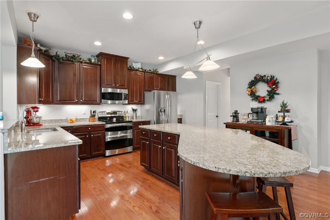 7031 Crackerberry Drive Moseley, VA 23120 - Photo 7 of 47 a kitchen with stainless steel appliances granite countertop a sink stove and refrigerator