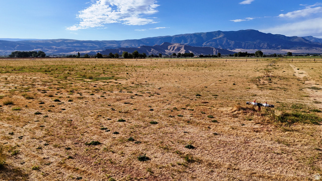 2070 East Tbd Road North Richfield, UT 84701 - Photo 29 of 35 Expansive open land with distant mountain ranges and a clear sky