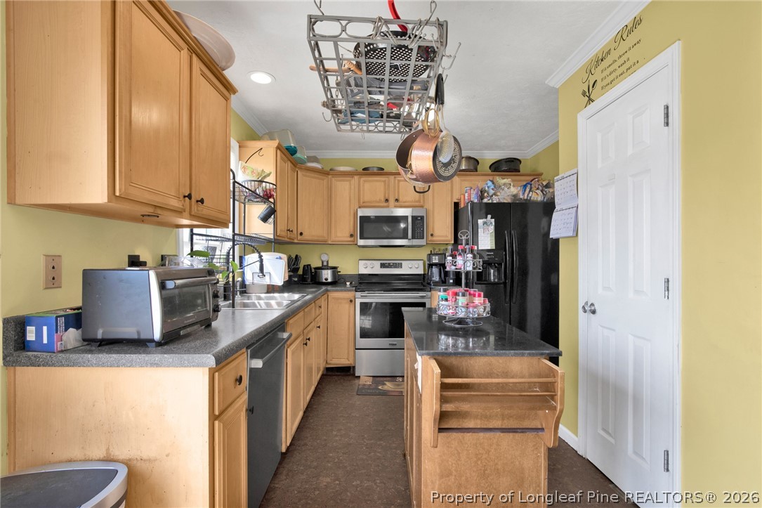 429 Bristlecone Road Fayetteville, NC 28311 - Photo 14 of 38 a kitchen with stainless steel appliances granite countertop a stove and a refrigerator