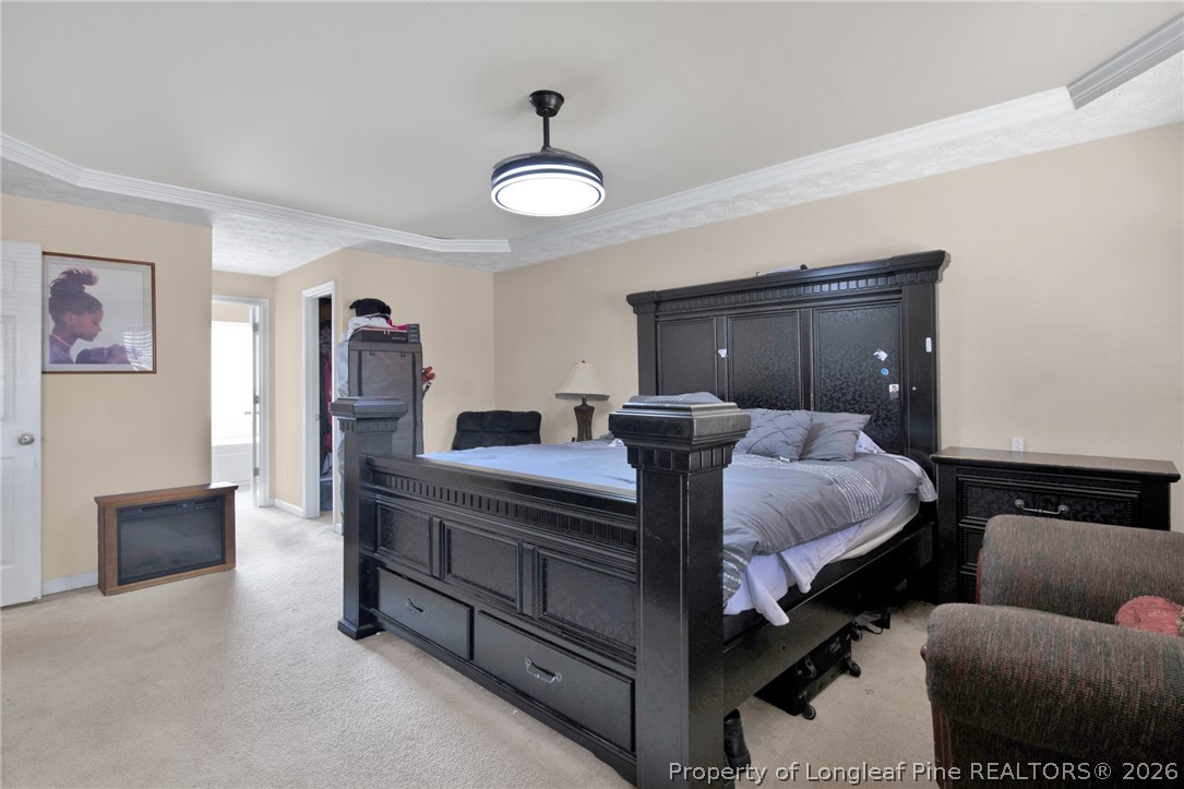 429 Bristlecone Road Fayetteville, NC 28311 - Photo 20 of 38 a bedroom with a bed and wooden floor