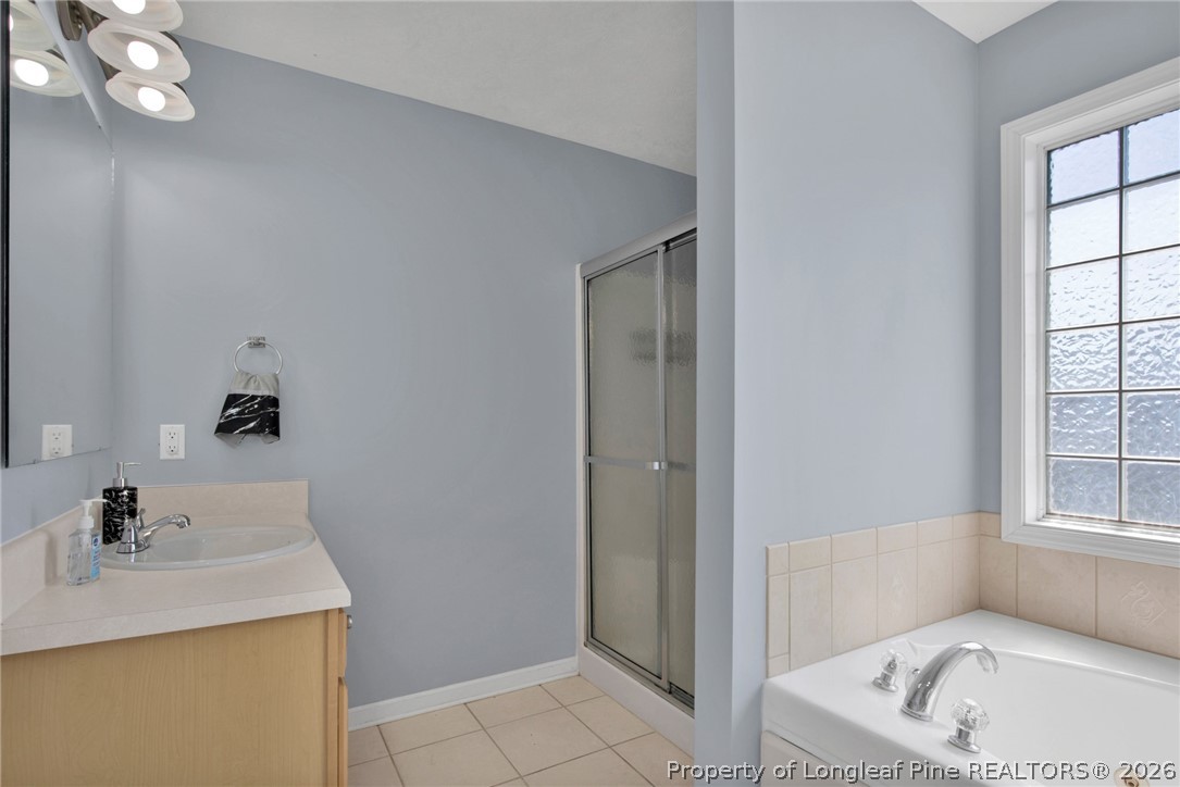 429 Bristlecone Road Fayetteville, NC 28311 - Photo 22 of 38 a bathroom with a sink a toilet and shower
