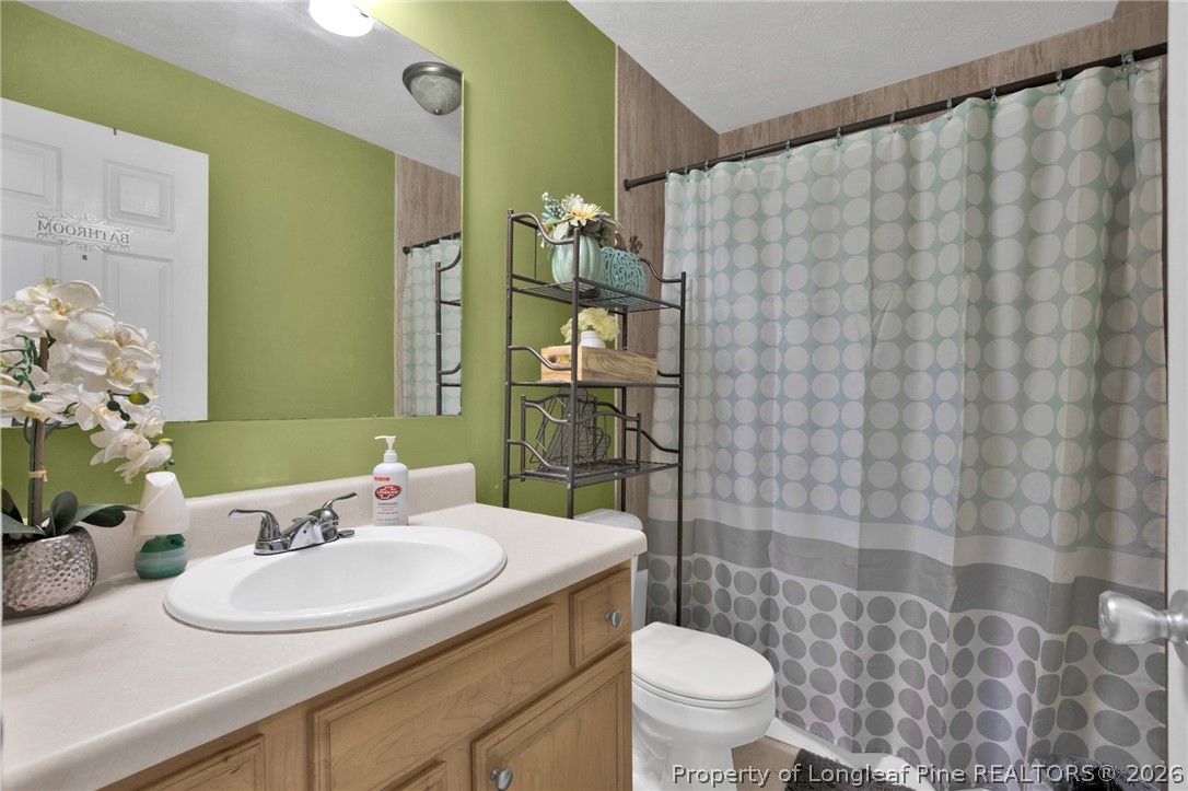 429 Bristlecone Road Fayetteville, NC 28311 - Photo 29 of 38 a bathroom with a sink and a mirror