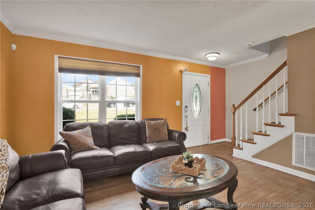 429 Bristlecone Road Fayetteville, NC 28311 - Photo 5 of 38 a living room with furniture and a dining table
