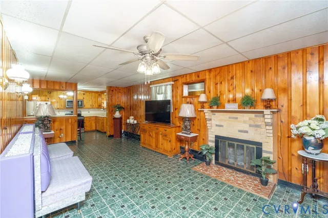 a large room with lots of furniture and a chandelier