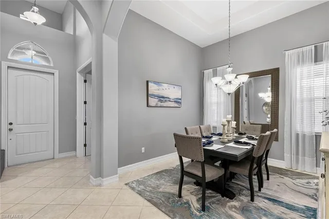 a view of a dining room with furniture and window