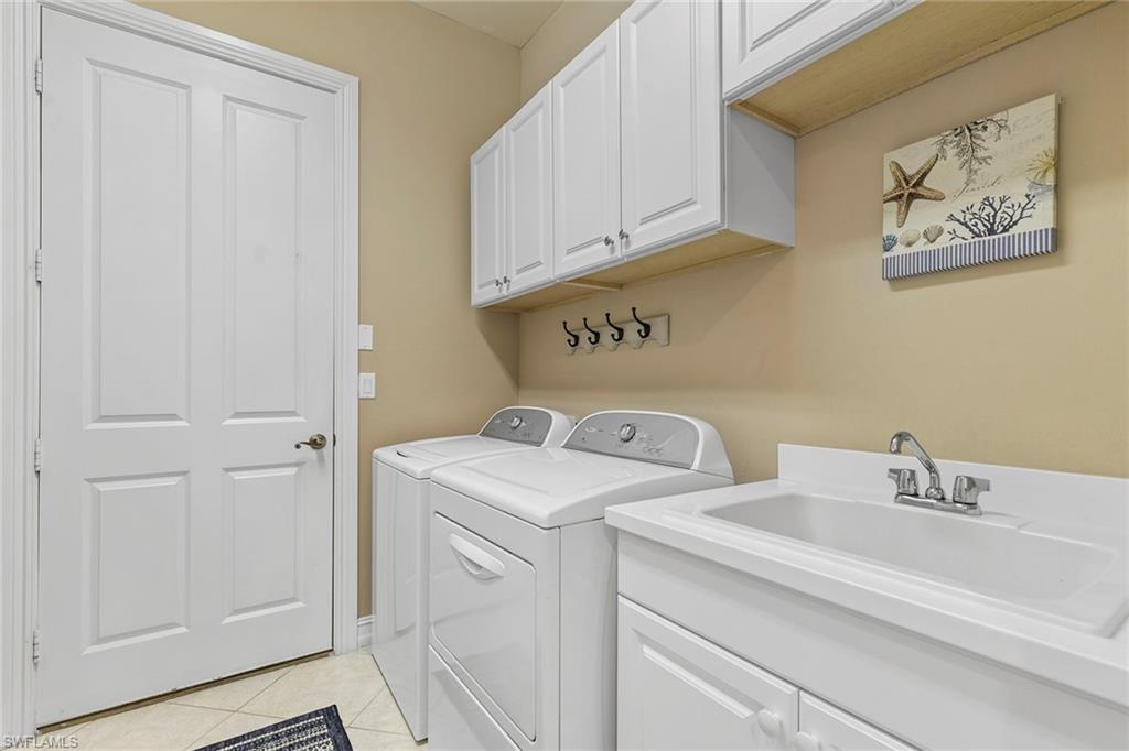 7778 Ashton Road Naples, FL 34113 - Photo 20 of 26 a utility room with dryer and washer