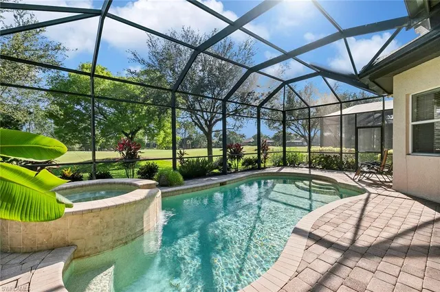 a view of a backyard with swimming pool