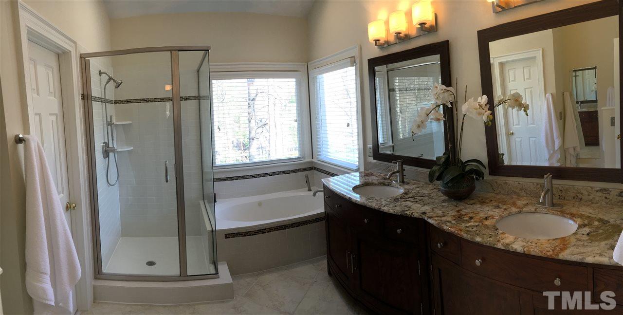 2506 Mayview Road Raleigh, NC 27607 - Photo 12 of 29 a bathroom with a granite countertop sink mirror and a bathtub