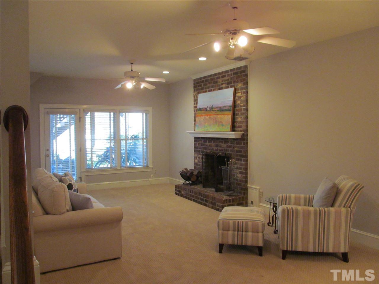 2506 Mayview Road Raleigh, NC 27607 - Photo 18 of 29 a living room with furniture and a fireplace