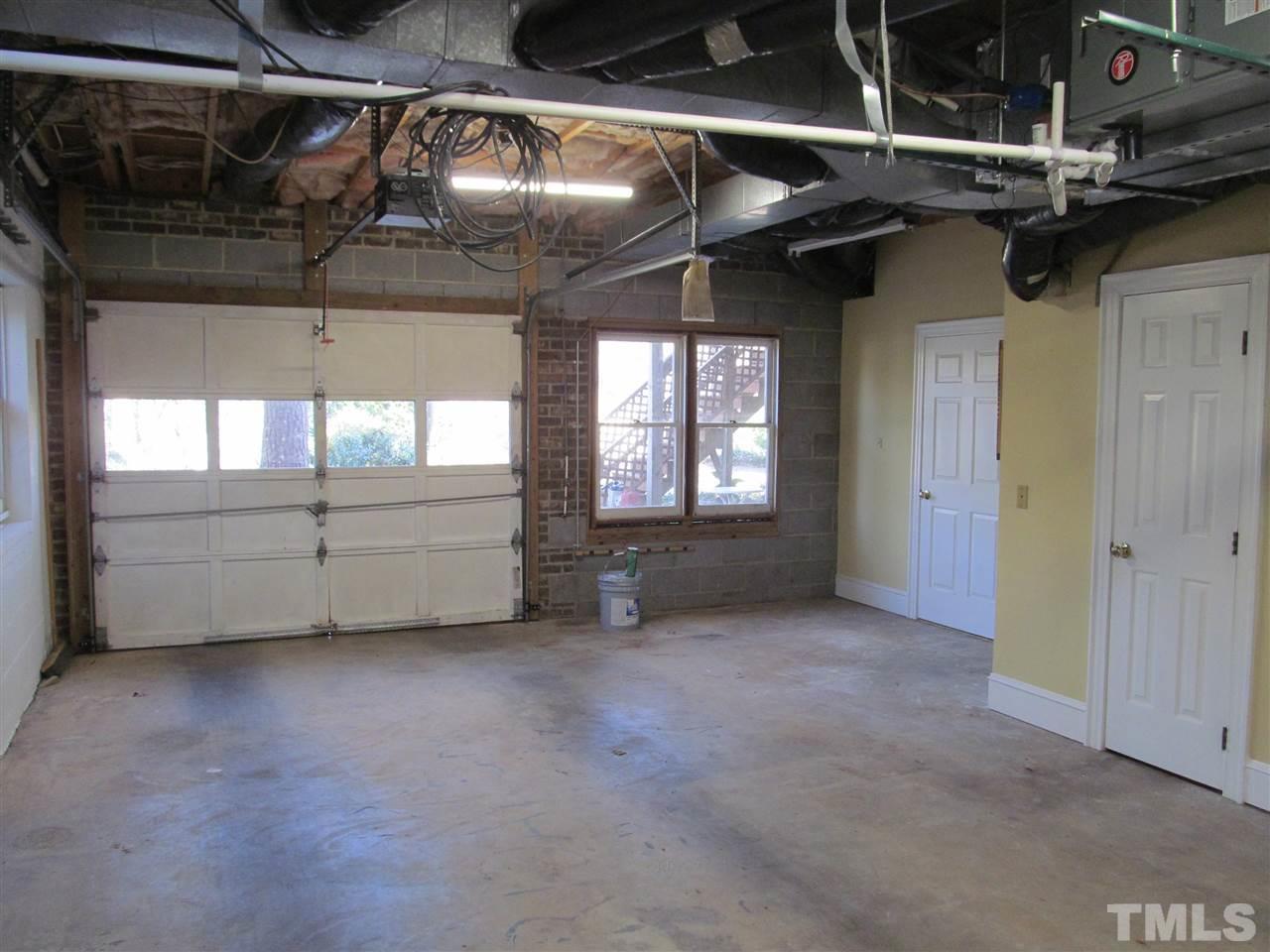 2506 Mayview Road Raleigh, NC 27607 - Photo 19 of 29 a view of an empty room with a fireplace