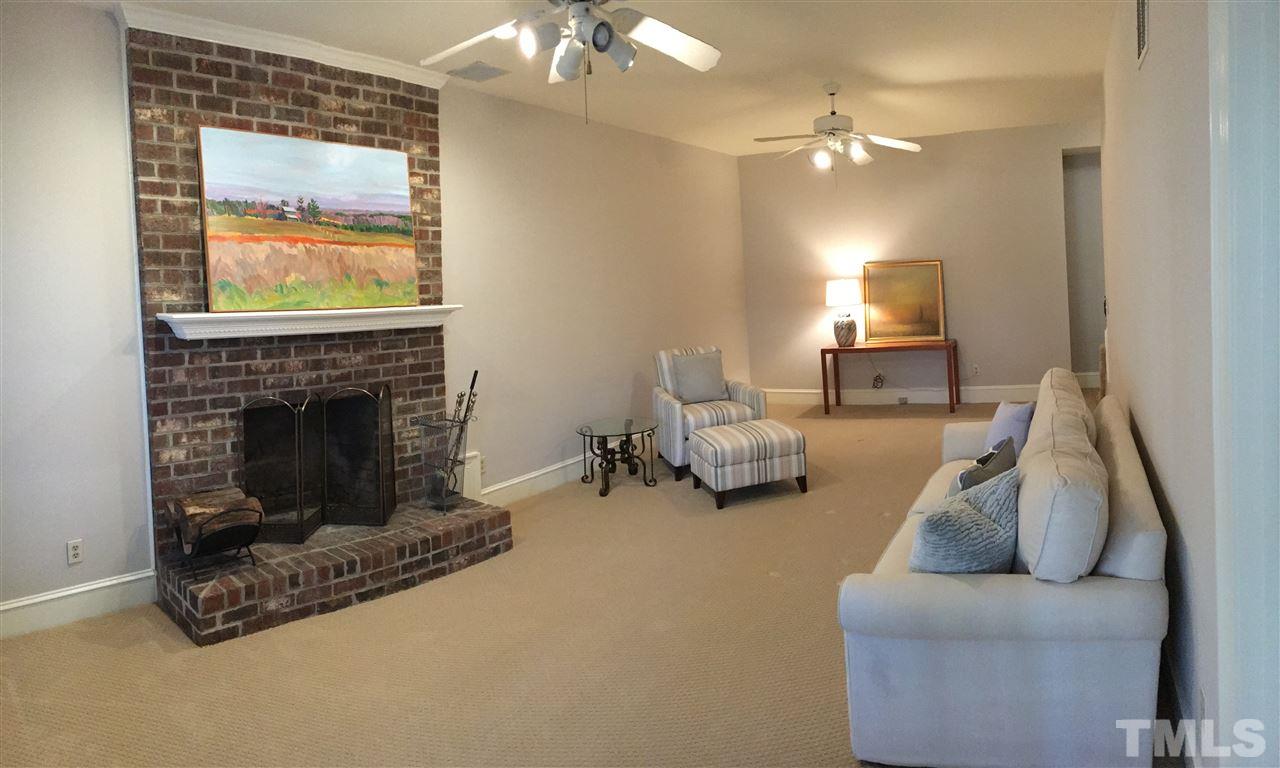 2506 Mayview Road Raleigh, NC 27607 - Photo 20 of 29 a living room with furniture and a fireplace
