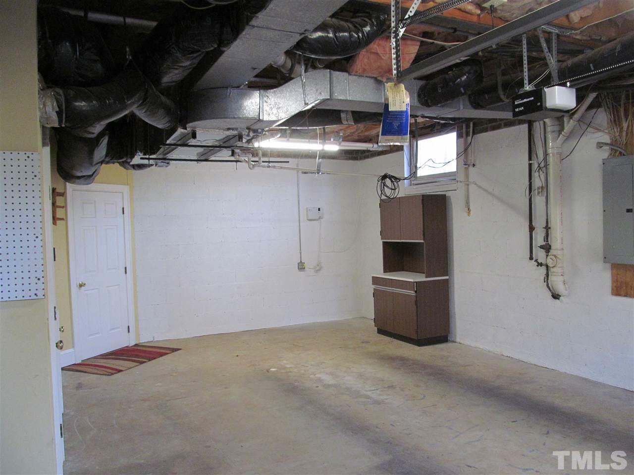 2506 Mayview Road Raleigh, NC 27607 - Photo 21 of 29 a view of a room with rack and racks