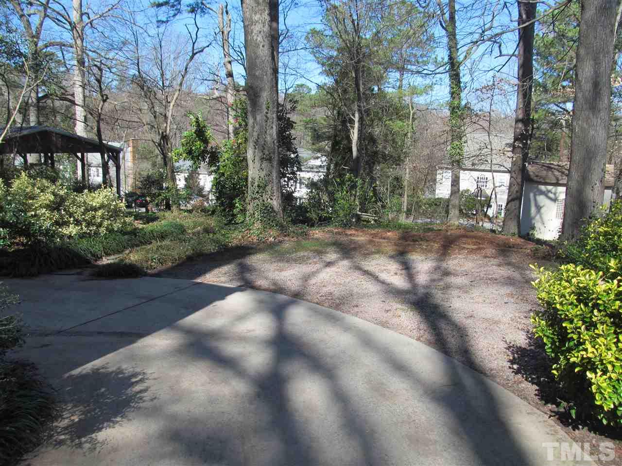 2506 Mayview Road Raleigh, NC 27607 - Photo 27 of 29 a view of a yard with plants and trees