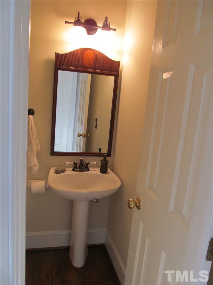 2506 Mayview Road Raleigh, NC 27607 - Photo 6 of 29 a bathroom with a sink and a mirror