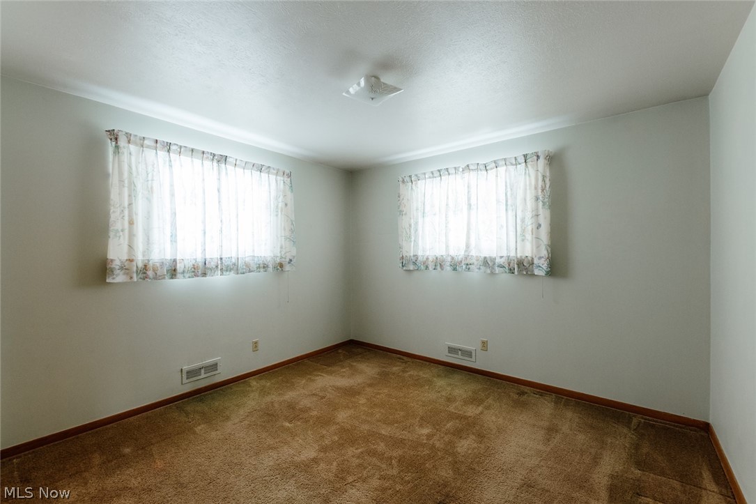 19545 Alexander Road Bedford, OH 44146 - Photo 19 of 29 Spare room with carpet and a healthy amount of sunlight