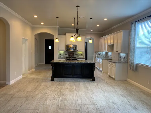 a bathroom with a sink vanity granite shower and a mirror