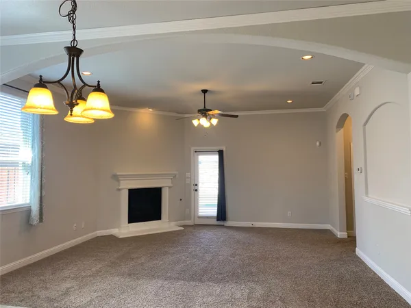 a kitchen with kitchen island granite countertop a sink a counter top space appliances and cabinets