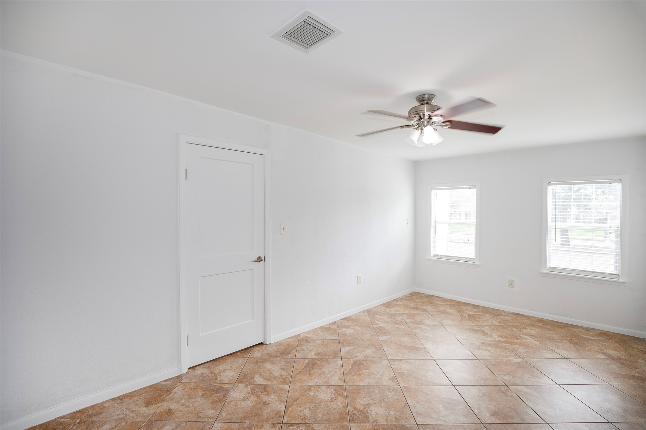 5535 Allendale Road Houston, TX 77017 - Photo 16 of 29 This bedroom has tall windows that overlook the front drive.