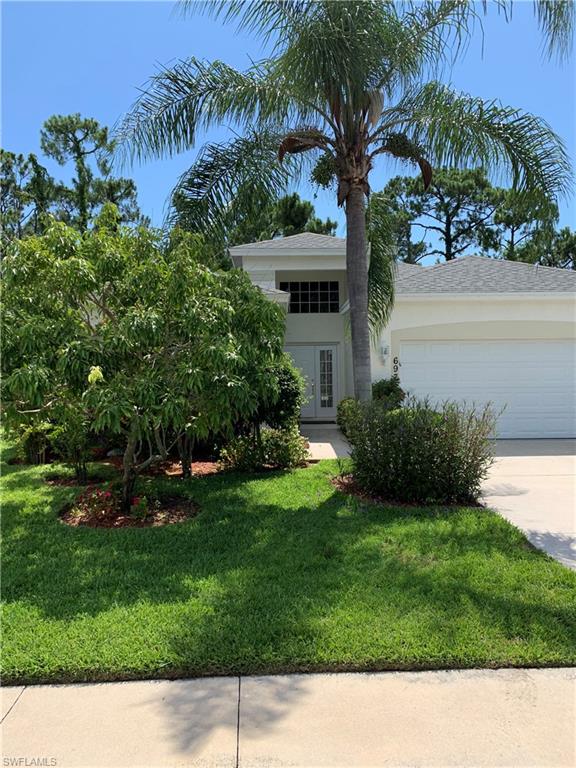 697 Crossfield Circle Naples, FL 34104 - Photo 1 of 12 a black and white photo of a house