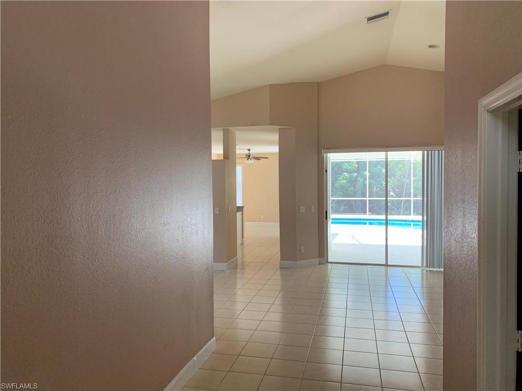 697 Crossfield Circle Naples, FL 34104 - Photo 2 of 12 a view of an empty room and window
