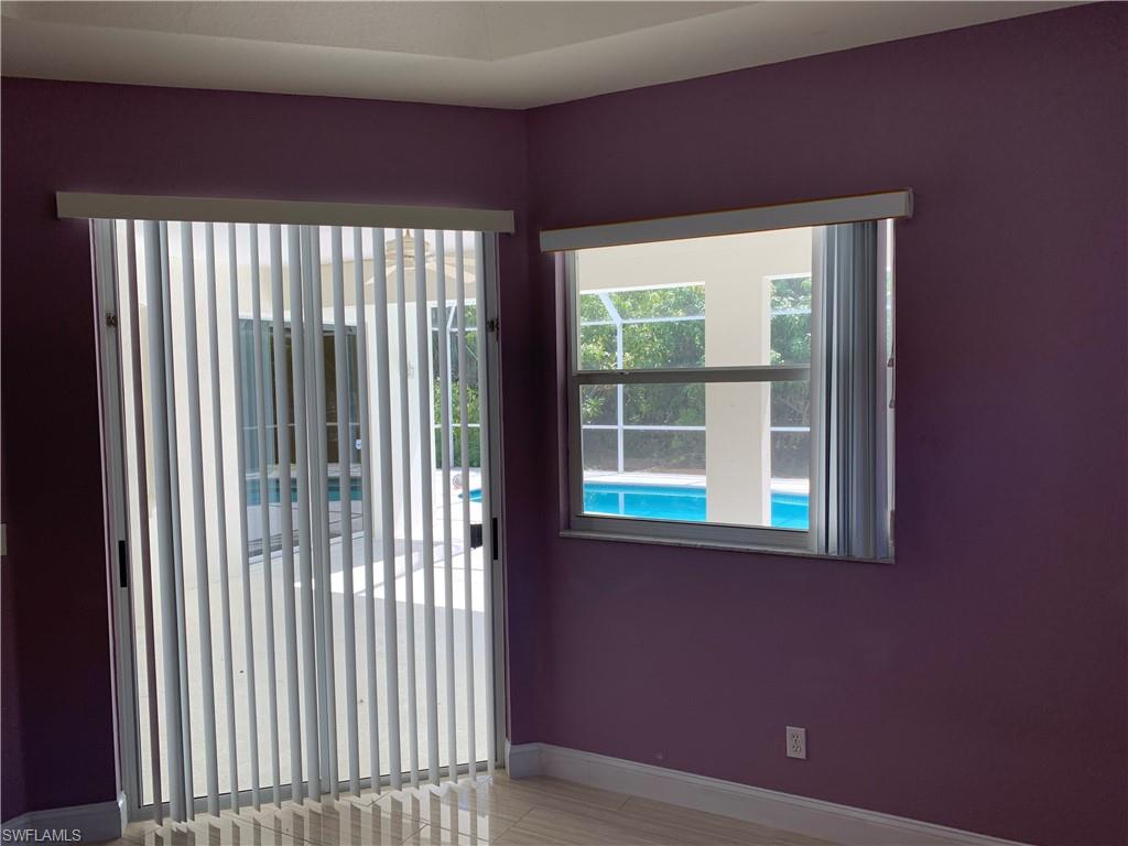 697 Crossfield Circle Naples, FL 34104 - Photo 8 of 12 a view of a livingroom with a window