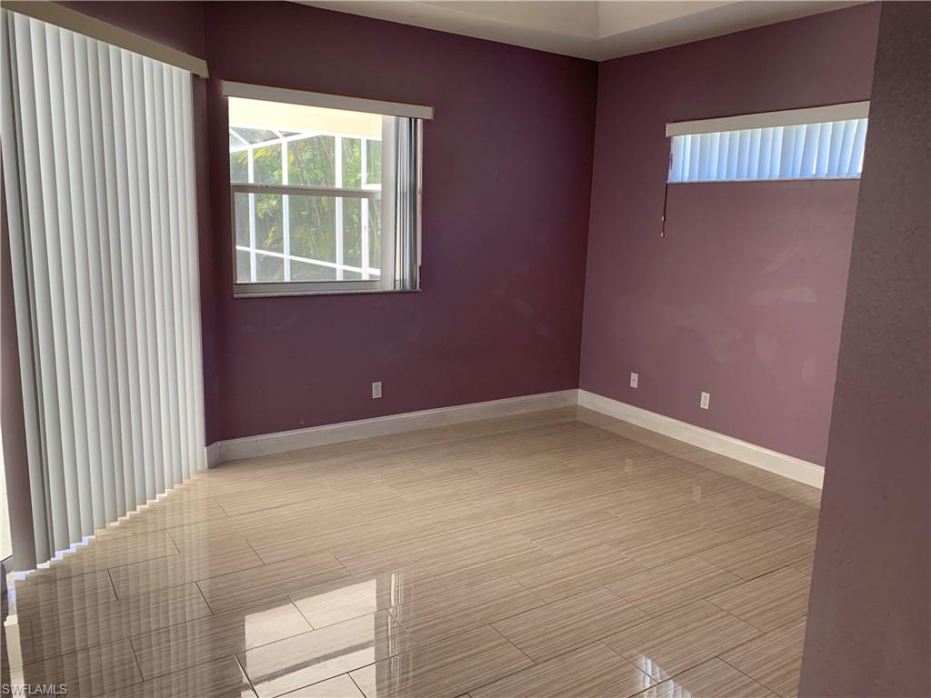 697 Crossfield Circle Naples, FL 34104 - Photo 9 of 12 a view of an empty room with a window