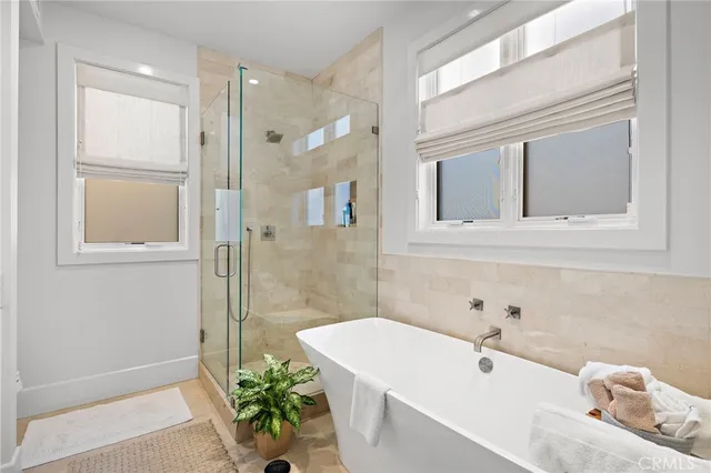 a view of living room with patio furniture and a potted plants
