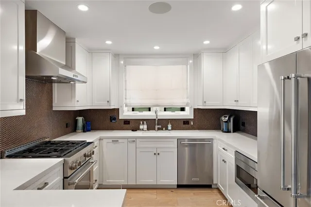 a bedroom with a bed table and a potted plant