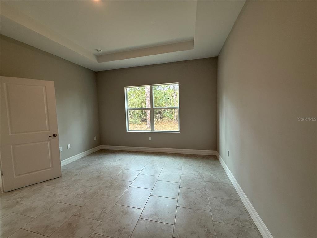 1569 Kerman Street North Port, FL 34288 - Photo 13 of 26 a view of an empty room with a window