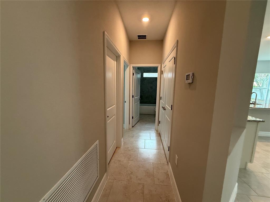 1569 Kerman Street North Port, FL 34288 - Photo 16 of 26 a view of a hallway with a hallway