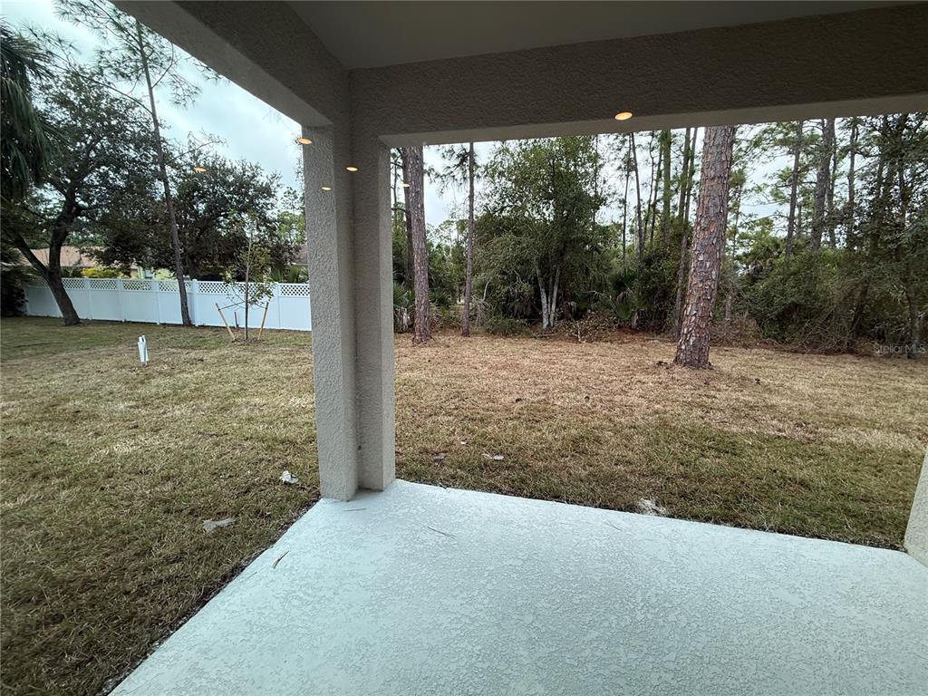 1569 Kerman Street North Port, FL 34288 - Photo 22 of 26 a view of a yard with large tree