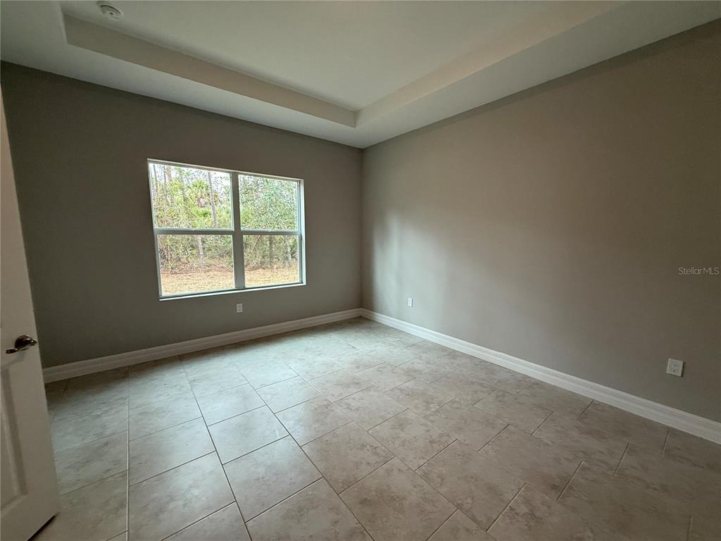 1569 Kerman Street North Port, FL 34288 - Photo 7 of 26 an empty room with windows