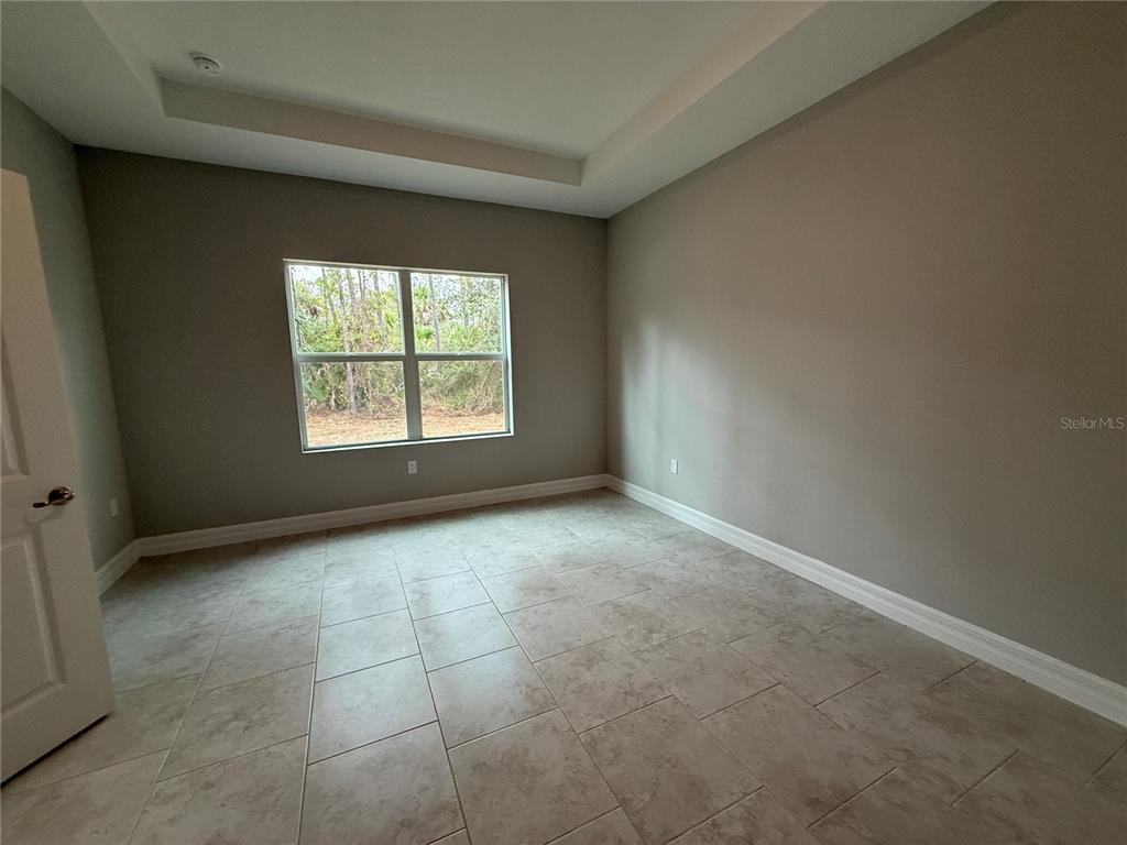 1569 Kerman Street North Port, FL 34288 - Photo 8 of 26 an empty room with a window