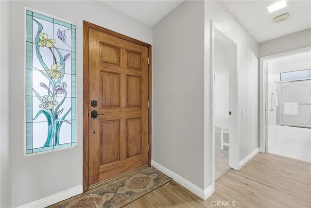 a view of front door with wooden floor