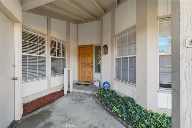 a view of a door with a chair and table