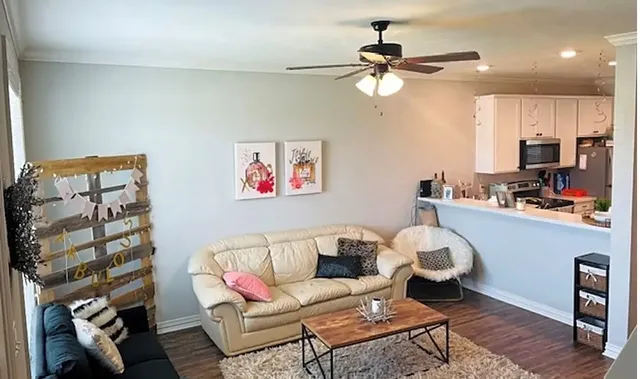 a living room with furniture and a window