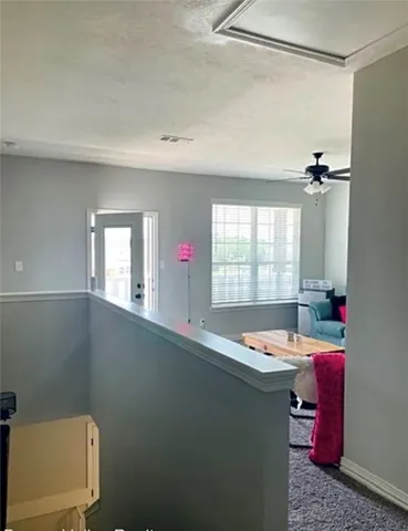 a room with a window a sink and a mirror