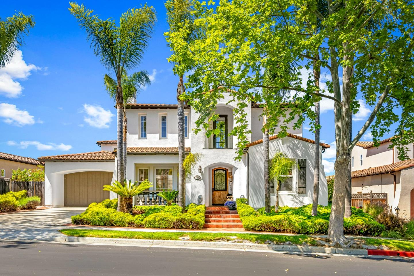 1913 St Andrews Circle Gilroy, CA 95020 - Photo 1 of 79 a front view of multi story residential apartment building with yard and outdoor seating