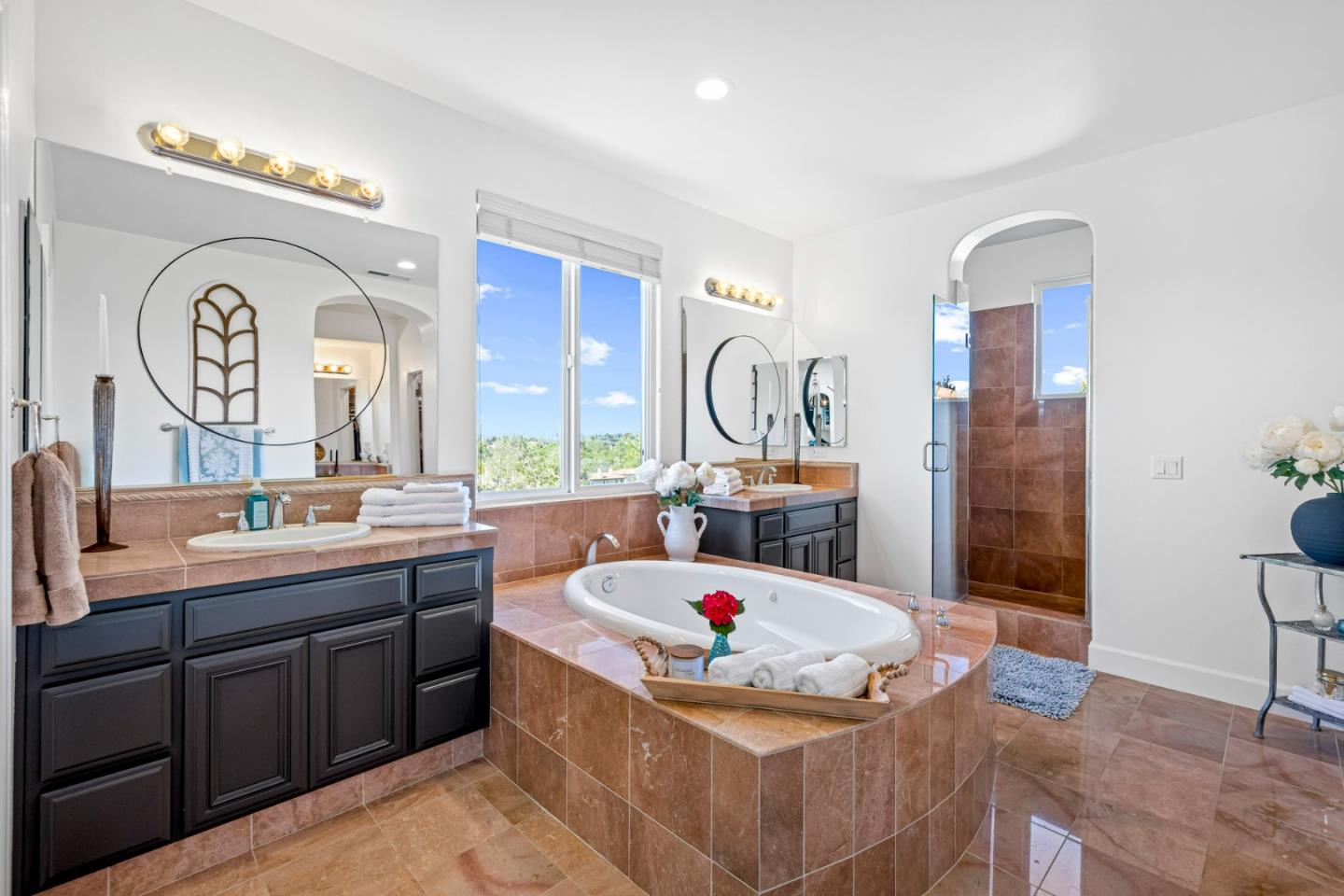 1913 St Andrews Circle Gilroy, CA 95020 - Photo 56 of 79 a large bathroom with a tub a sink and a mirror